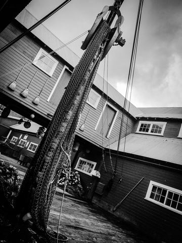 Documentary photography example: Where the nets tell the day's story before the fishermen do.